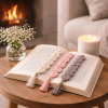 Hand-crocheted bookmarks styled with candlelight and books